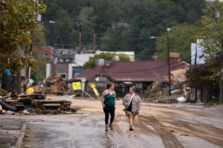 Women walk in the Biltmore Village in the aftermath of Hurricane Helene