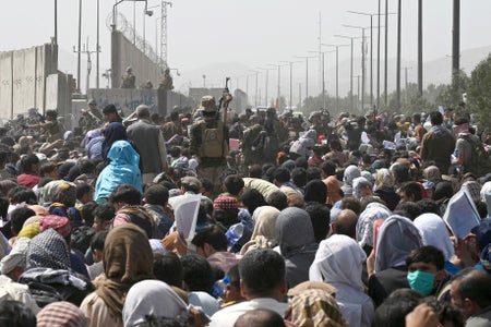 A mass of people gathered in the road hoping to evacuate.