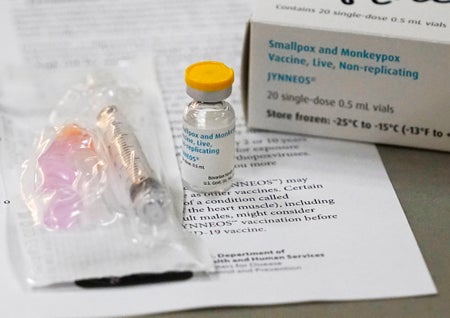 A vial of the Monkeypox (Monkey Pox) vaccine sits on a table .