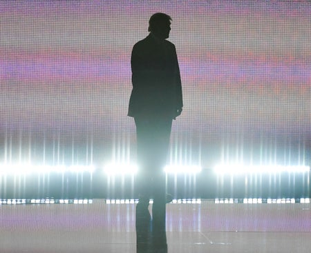 Donald Trump silhouette with digital background.