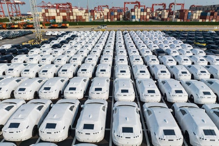 Hundreds of electric vehicles are readied for shipment to Europe in a lot at the Port of Taicang in Taicang, Jiangsu Province, China