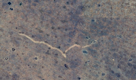 satellite image of a mysterious scar etched into the barren landscape.