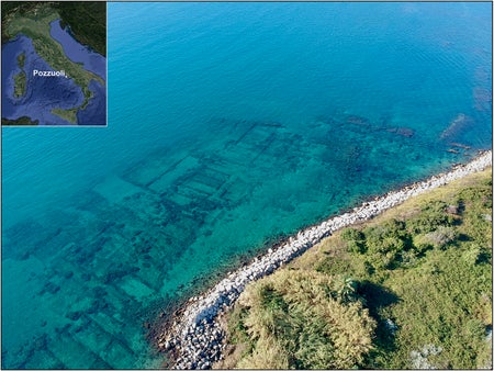 Aerial view of the submerged ancient warehouse district along the Pozzuoli coast.