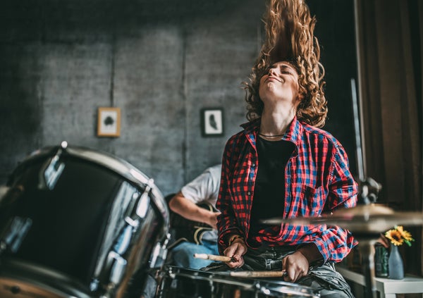 Teenager Playing Rock and Roll At Home